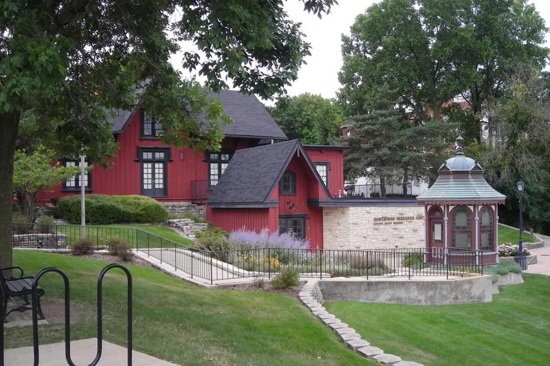 Historic Batavia Depot Museum with its iconic red building and stone gazebo