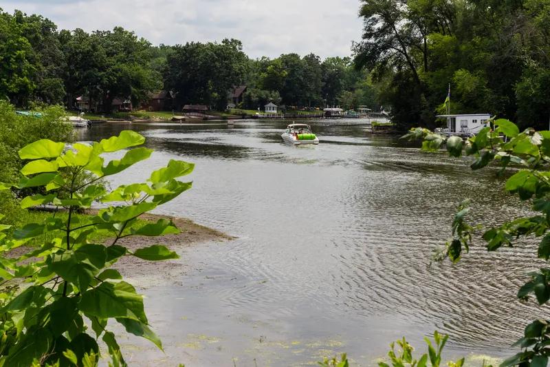Boating on the Fox River near McHenry, Illinois with waterfront homes along the shore