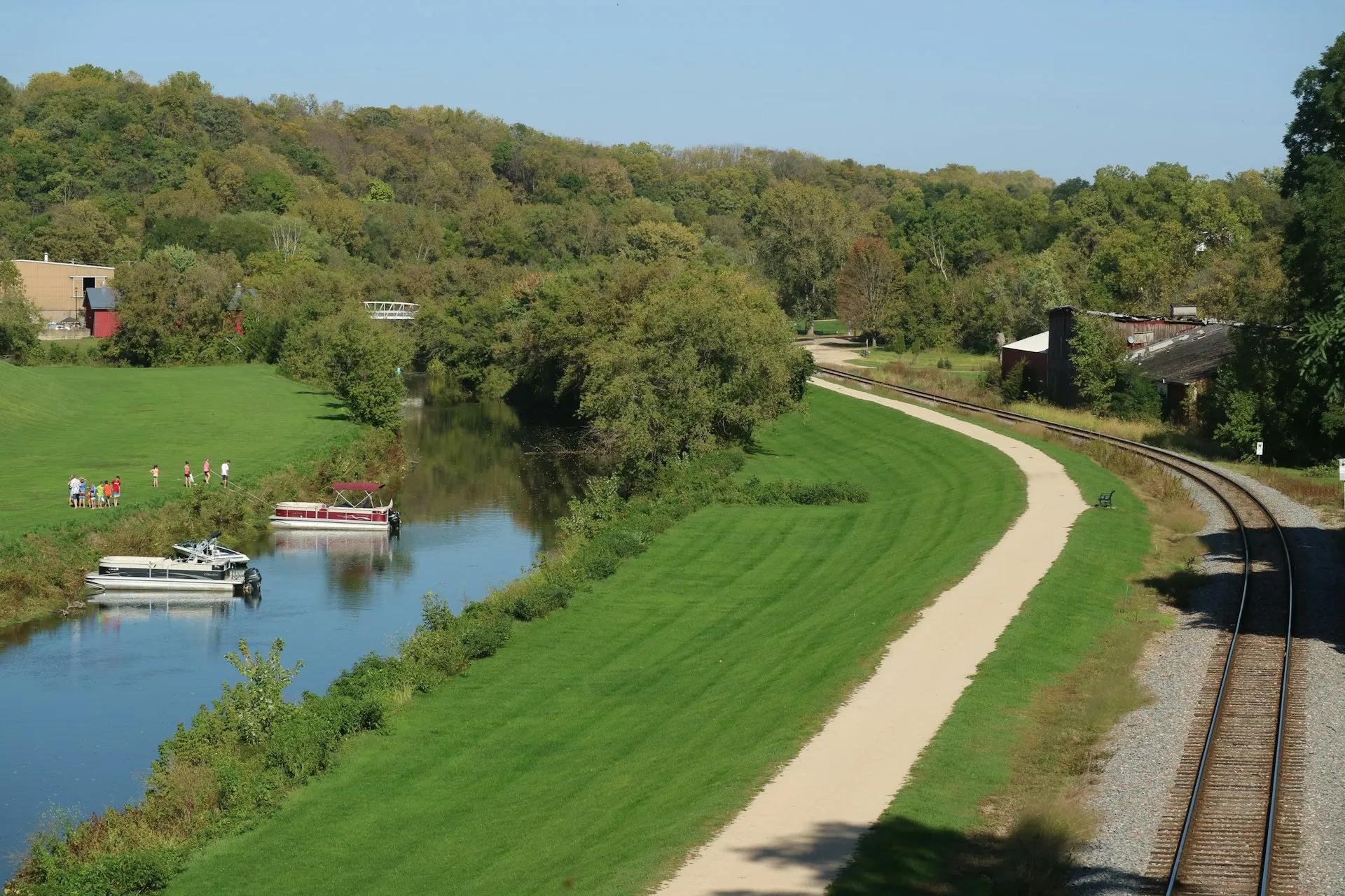 Lush green Illinois countryside with a gentle river winding through open farmland